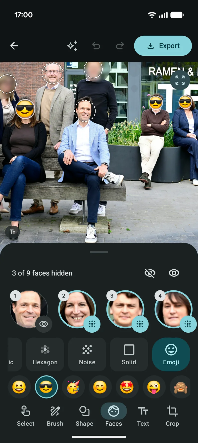 Faces found in a photo, covered with blur and emoji